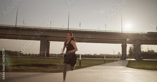 Powerful woman running fast on sidewalk