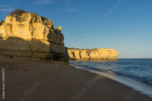 Landscape of Coelho y Mare beaches and cliffs in the Algave region at sunset. Portugal.