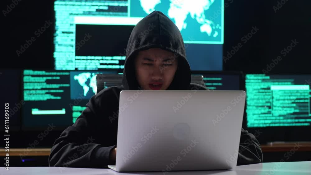 Asian Female Hacker In A Hood Having A Headache While Works On A Laptop With Maps And Data On Display Screens Of Multiple Monitors In A Dark Office Room
Asian Female Hacker In A Hood Having A Headache While Works On A Laptop With Maps And Data On Display Screens Of Multiple Monitors In A Dark Office Room