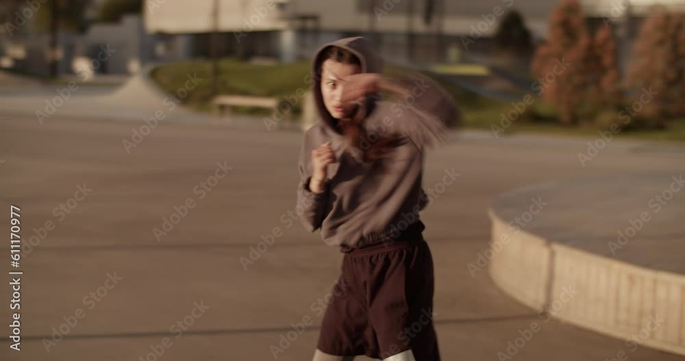 Powerful female boxer during morning workout Powerful female boxer during morning workout