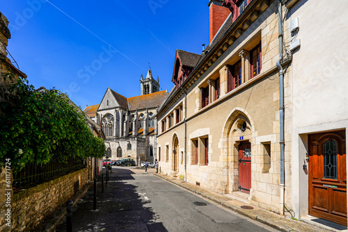 Fototapeta Naklejka Na Ścianę i Meble -  Old street leading to Our Lady of the Nativity Church in the former medieval walled city of Moret-sur-Loing in Seine et Marne, France