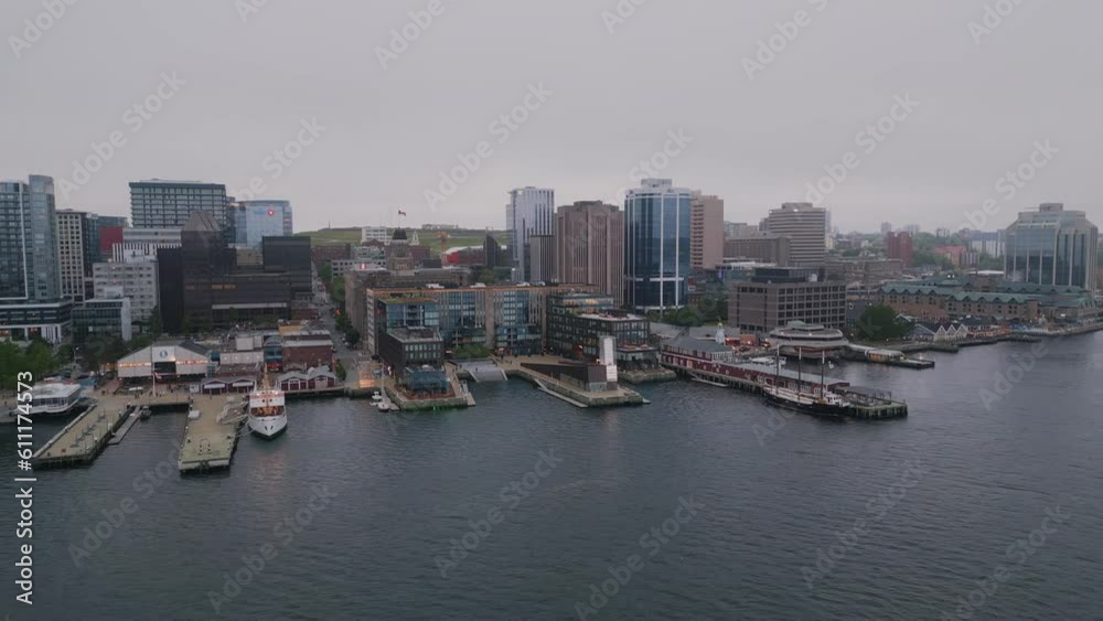 Canada, Halifax, Aerial Drone Shots on Business Center and Pier with Skyscraper in the City Center on a Cinematic Background. Cityscape View of Financial and Residential Buildings on a Cloudy Evening Canada, Halifax, Aerial Drone Shots on Business Center and Pier with Skyscraper in the City Center on a Cinematic Background. Cityscape View of Financial and Residential Buildings on a Cloudy Evening