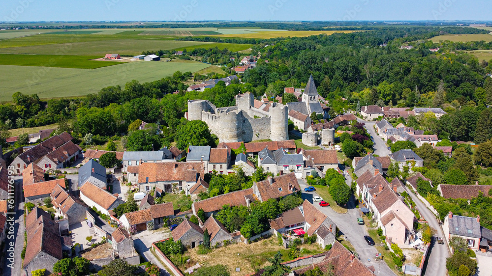 Aerial view of the medieval castle of Yèvre le Châtel in the French department of Loiret - Enclosure with 4 round towers at the top of a hill in a rural village