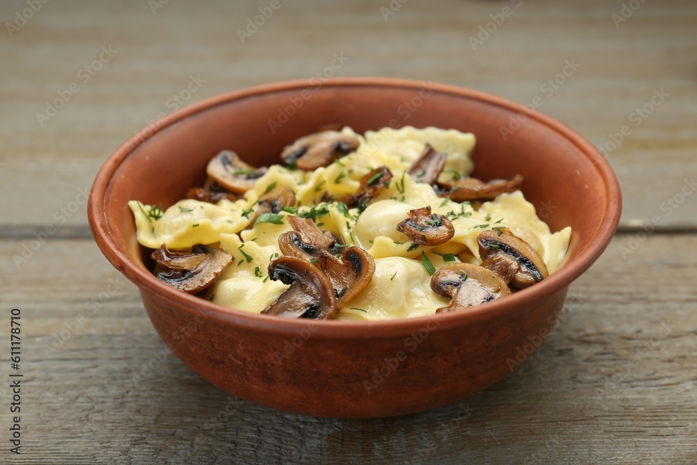 Delicious ravioli with mushrooms on wooden table, closeup Delicious ravioli with mushrooms on wooden table, closeup