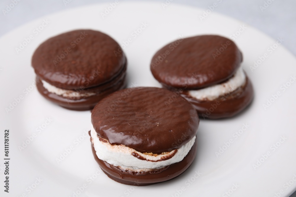 Tasty sweet choco pies on plate, closeup