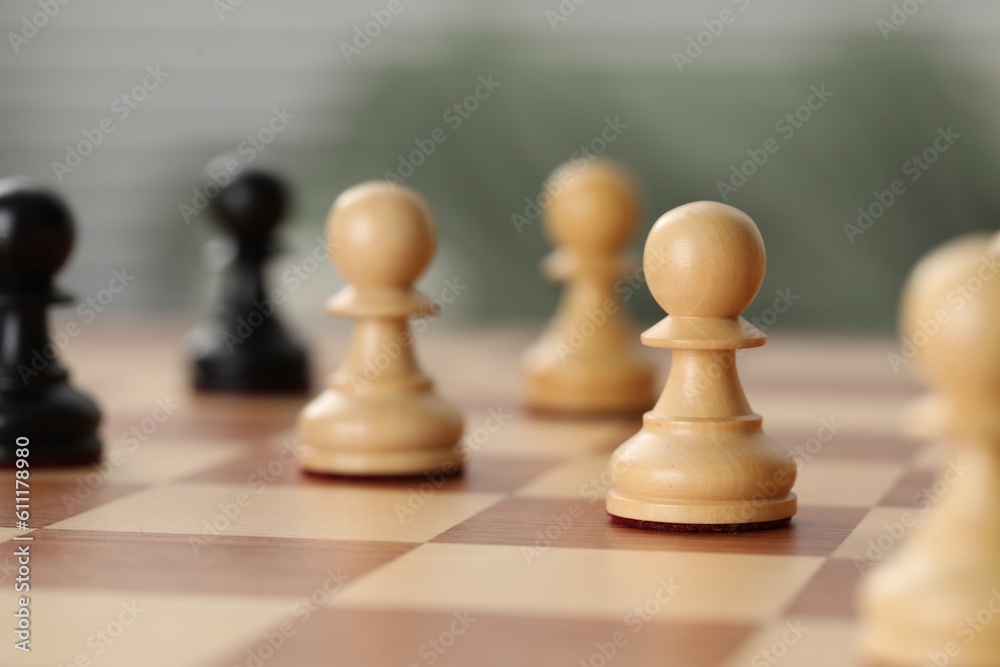 Wooden pawns on chess board, closeup. Space for text Wooden pawns on chess board, closeup. Space for text