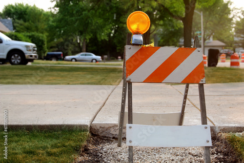 Road work ahead expect  Delays. Cones telling motorists to be alert as they are entering a contruction  suburb area.