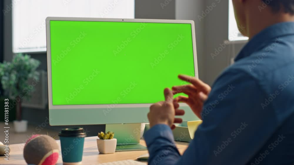 Manager talking mockup computer at video call. Unknown man looking green screen Manager talking mockup computer at video call. Unknown man looking green screen