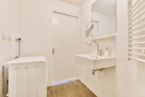 a bathroom with white walls and wood flooring in the shower area, including a sink and mirror on the wall