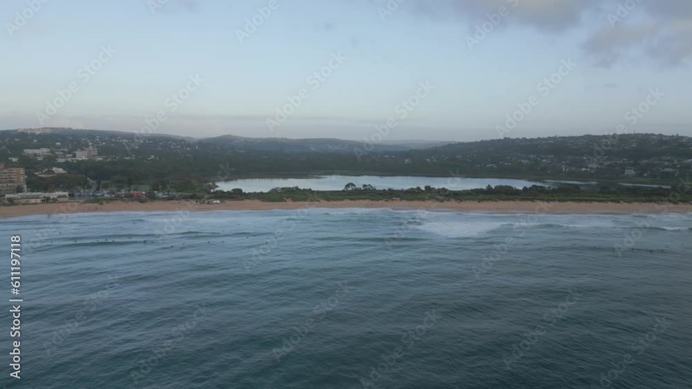 Dee Why Sydney Northern Beaches, New South Wales, Australia. Aerial reverse pull back shot on a cloudy morning.