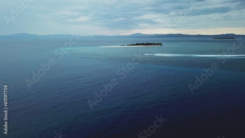 Drone Nadi Fiji Namotu Island Swimming Pools surf wave for surfers aerial cinematic cloudy morning beautiful peaceful relaxing honeymoon adventure resort lagoon mountain beach forward pan up movement photo