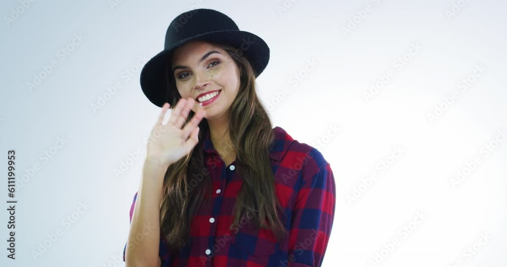 Woman smile, hand wave and face blowing kiss in a studio with hipster fashion. Isolated, white background and young female portrait feeling happy and joy from greeting and kissing hands gesture Woman smile, hand wave and face blowing kiss in a studio with hipster fashion. Isolated, white background and young female portrait feeling happy and joy from greeting and kissing hands gesture