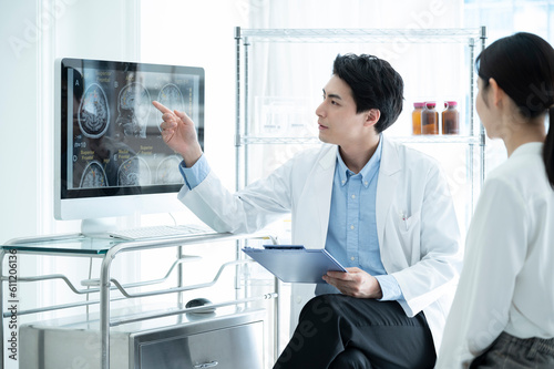 Neurosurgeon telling patient the results of the test photo