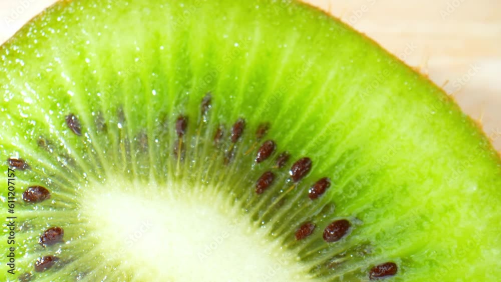 Intricate and vibrant, the macro video of a kiwi fruit reveals a lush green interior dotted with tiny black seeds, surrounded by succulent, juicy flesh. Food and health concept. Kiwi background. 4K
Intricate and vibrant, the macro video of a kiwi fruit reveals a lush green interior dotted with tiny black seeds, surrounded by succulent, juicy flesh. Food and health concept. Kiwi background. 4K