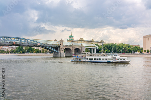 View of the Moscow river embakment, Pushkinsky bridge and cruise ships at sunset. © Dmitrii Potashkin