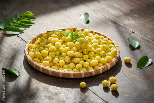 Vietnamese food fresh star gooseberry traditional life style decoration with wooden table and green leaf             photo