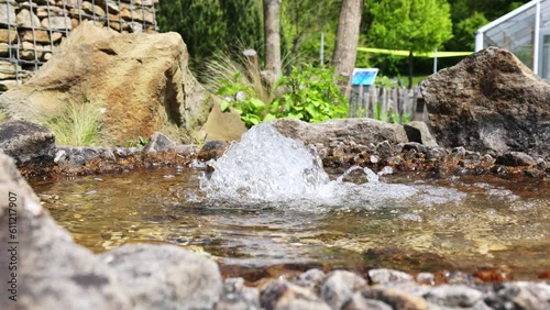 A small fountain in the sauerlandpark hemer on a spring day photo