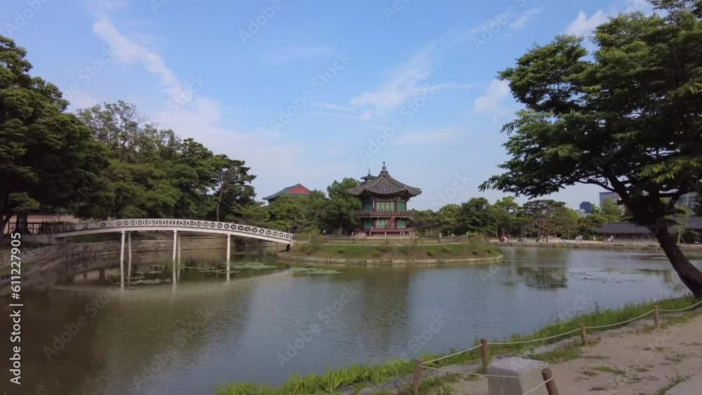 A beautiful Korean traditional palace stone wall floating on water and bridge A beautiful Korean traditional palace stone wall floating on water and bridge