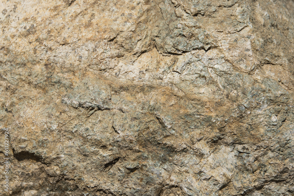 Texture of natural yellow stone in sunlight Texture of natural yellow stone in sunlight