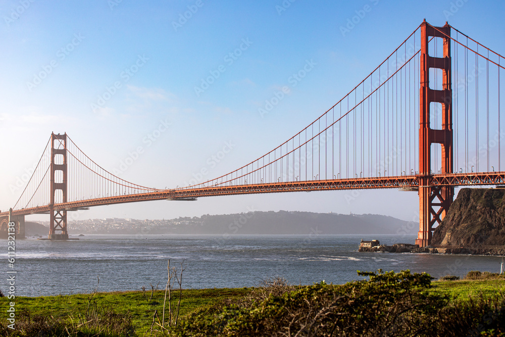 Picture of the Golden Gate Bridge in San Francisco crossing the bay of the Californian city under a blue sky. Famous bridge in the state of California in the United States of America. Concept USA.