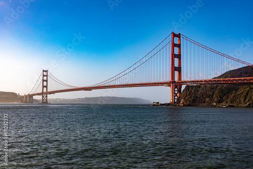 The Golden Gate Bridge in San Francisco over the bay of the Californian city under a blue sky and ocean. Famous bridge in the state of California and seen from a viewpoint. Concept USA. © Lifes_Sunday