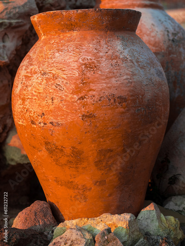 Close up of large orange terracotta clay container earthenware pot