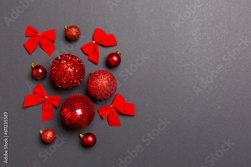 Top view of festive winter composition on colorful background with empty space for your design. Christmas baubles and decorations. New Year concept