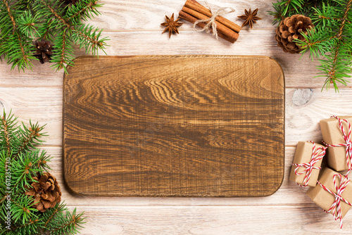 wood cutting board at table background with christmas decoration, Round board. New Year concept