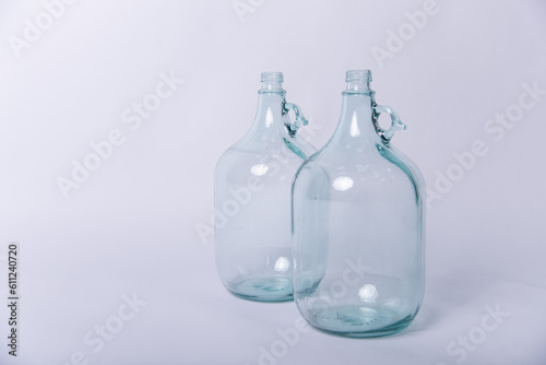 empty glass bottle on white © Gelena
