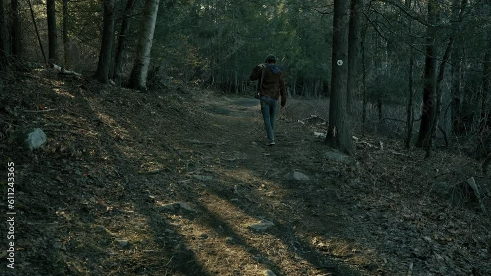 custom made wallpaper toronto digitalYoung photographer walks down wooded path (wide)