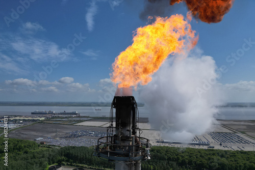 Industrial oil refinery flare stack, Immingham petroleum production plant photo