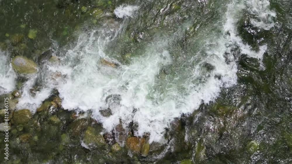view from the drone that rises quickly of the waters of the river in flood with fishermen - increase of level water after rainstorm view from the drone that rises quickly of the waters of the river in flood with fishermen - increase of level water after rainstorm