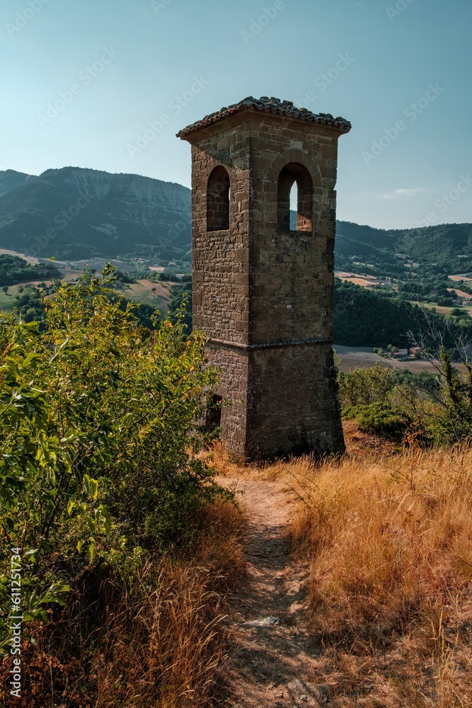 Obraz premium The old medioeval tower of Pietrarubbia's village in the region of Marche in central Italy