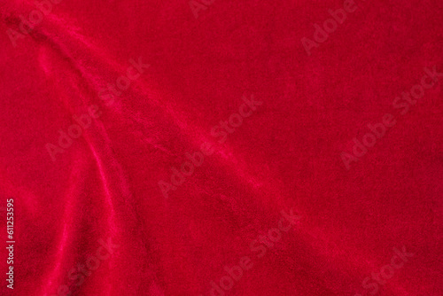 Red velvet fabric texture used as background. red fabric background of soft and smooth textile material. There is space for text..