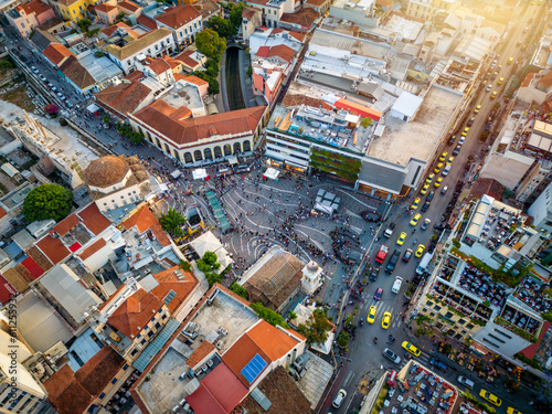 Fototapeta Naklejka Na Ścianę i Meble -  Aerial view of the popular Monastiraki square with numerous restaurants and shops in the center of Athens, Greece, during sunset time