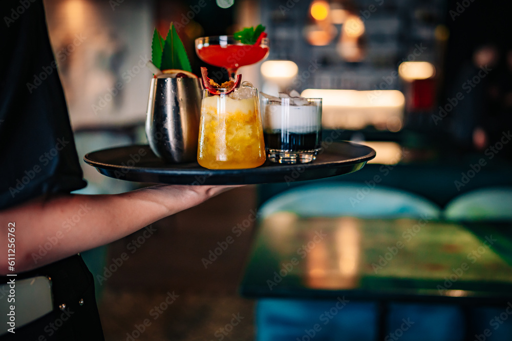 glasses alcohol cocktail set on a waiter tray in bar glasses alcohol cocktail set on a waiter tray in bar