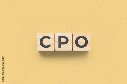 CPO (Chief People Officer) wooden cubes on yellow background