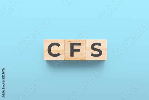 CFS (Chronic Fatigue Syndrome) wooden cubes on red background