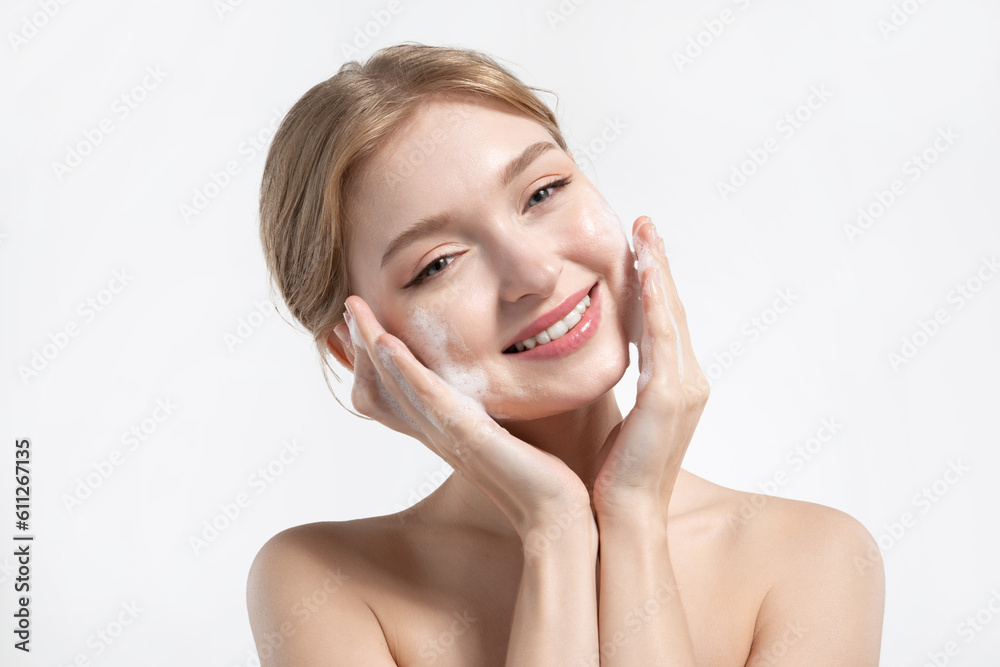 Beautiful girl washes her face with foam and enjoys self-care Beautiful girl washes her face with foam and enjoys self-care