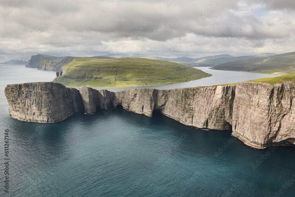 Faroe islands dramatic coastline in Vagar. Leitisvatn lake