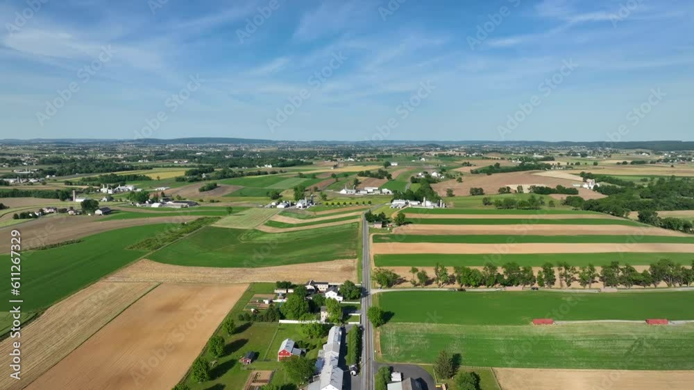 Beautiful farmland and sky on early summer day in America. Aerial dolly forward in Amish country. Beautiful farmland and sky on early summer day in America. Aerial dolly forward in Amish country.