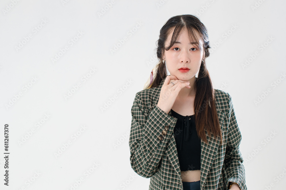 Portrait isolated cutout studio shot of Asian young cute female fashion model with pigtails braids hairstyle in casual plaid suit and crop top shirt standing posing look at camera on white background Portrait isolated cutout studio shot of Asian young cute female fashion model with pigtails braids hairstyle in casual plaid suit and crop top shirt standing posing look at camera on white background