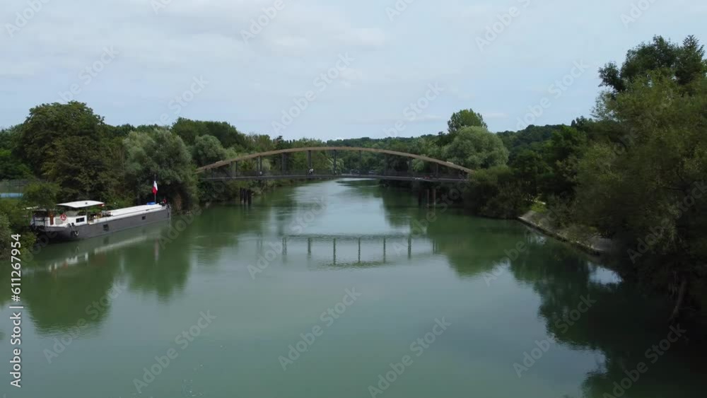 Aerial shoot by drone of a bridge over a river. Chalifert, France Aerial shoot by drone of a bridge over a river. Chalifert, France