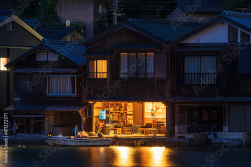 Night view of traditional boathouses at Ine Town in Kyoto, Japan.