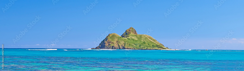 Blue water, tropical island travel and Hawaii with clear sky in summer in nature on holiday. Natural background, sunshine and sunrise at the ocean and beach of Oahu outdoor with sea and mockup space
