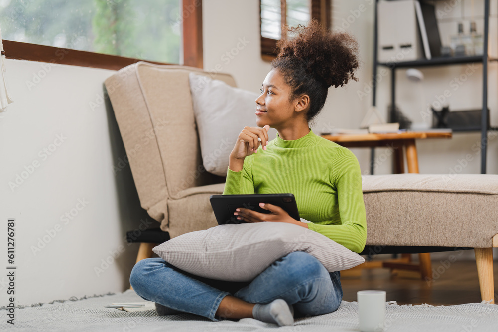 African American woman working at her home. girl studying online