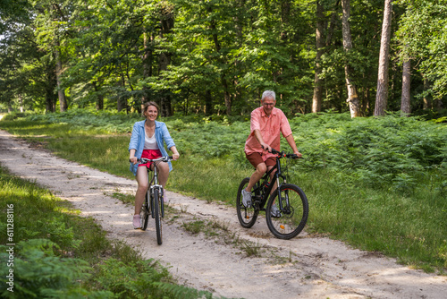 Senior man and his daughter enjoying of the summer nature