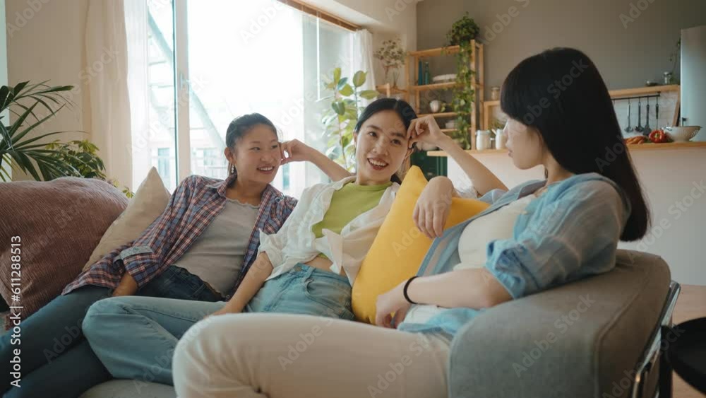 Group of female friends enjoying life and having fun at home. Girls day in the apartment. Young women spending time together chatting and making activities in the living room. Concept about lifestyle Group of female friends enjoying life and having fun at home. Girls day in the apartment. Young women spending time together chatting and making activities in the living room. Concept about lifestyle