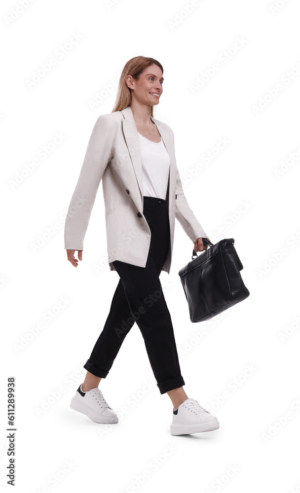 Beautiful happy businesswoman with briefcase walking on white background Beautiful happy businesswoman with briefcase walking on white background