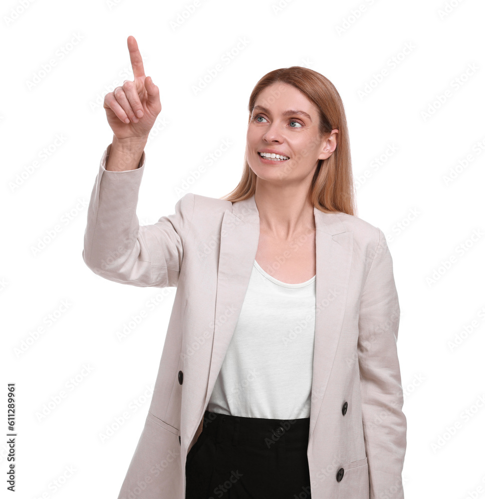 Beautiful happy businesswoman pointing at something on white background Beautiful happy businesswoman pointing at something on white background